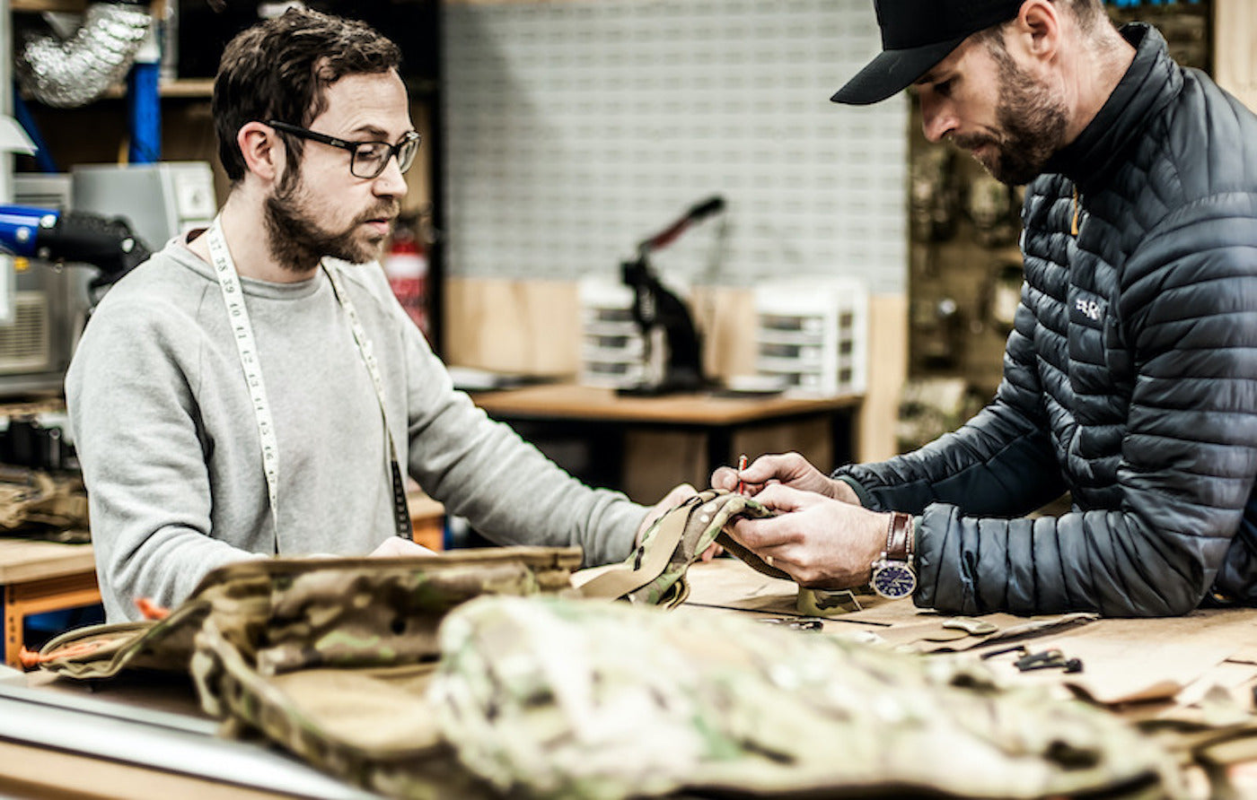 Military and Textile Crew working on a design